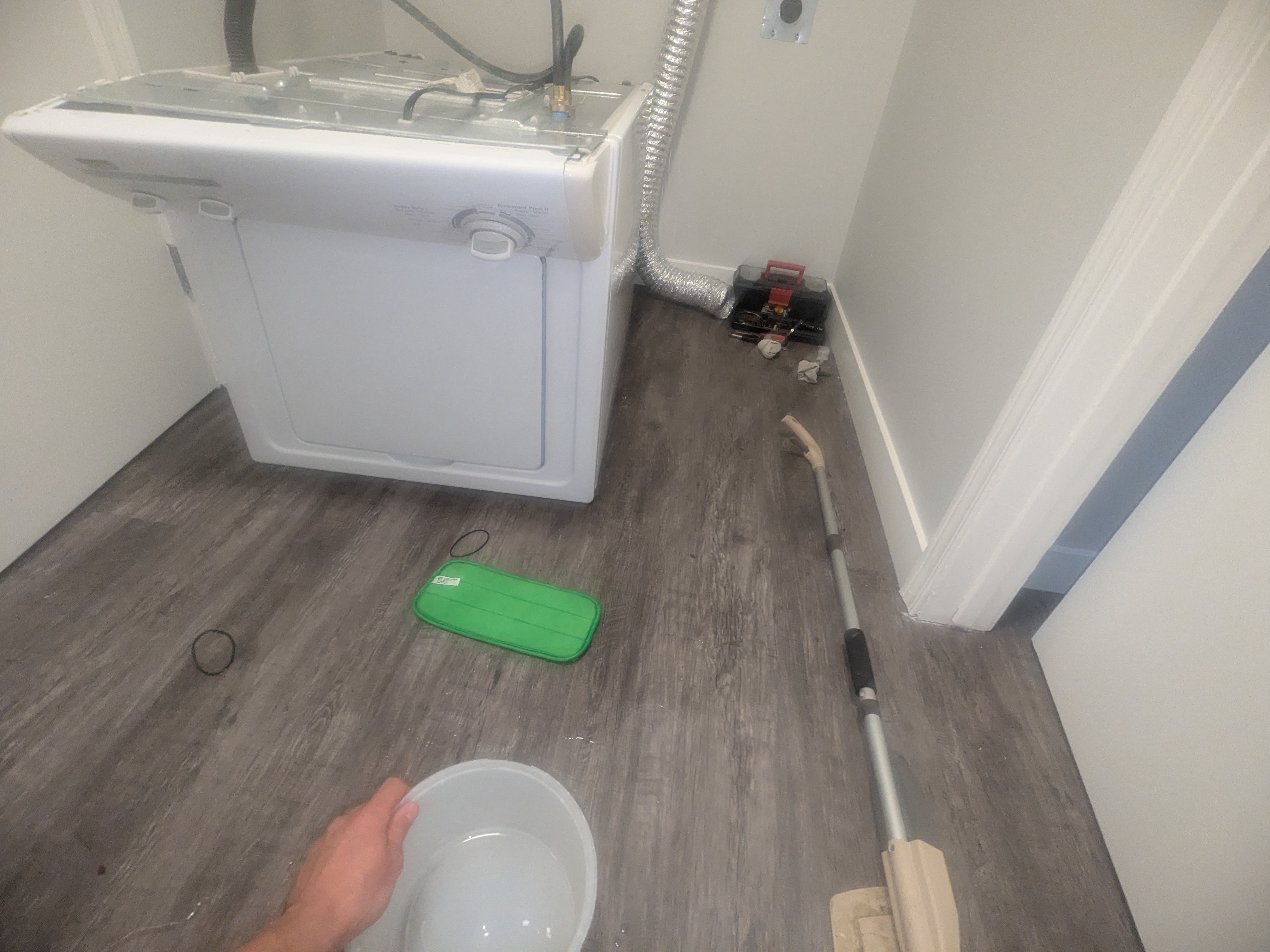 The aftermath - cleaning up water from the floor during the first install mishap
